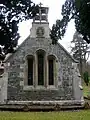 Stained glass windows and belfry.