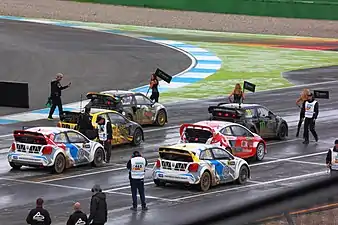 Cars line up on the grid before a Semi-Final