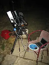 Image 35An amateur astrophotography setup with an automated guide system connected to a laptop. (from Observational astronomy)