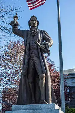 Bronze sculpture of James Otis, Jr stands to the left of the courthouse entrance