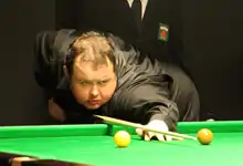 Stephen Lee playing a break off shot