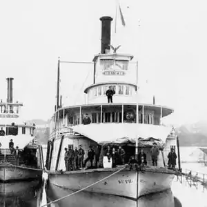 The large trapezoidal tarpulin rigged over the foredeck was a distinctive feature of Willamette River sternwheelers.