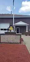 The town hall in Stilesville, Indiana, with a memorial for the old school.