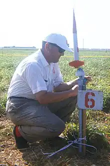 G. Harry Stine with model rocket