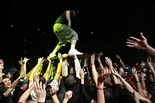 Bassist Kyle McDonald crowdsurfing