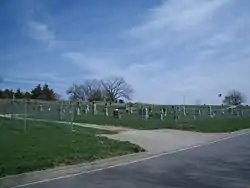 Stull Cemetery (facing northeast) in 2007. The remnants of the old church are visible in the background.