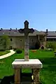 Cross the courtyard of the monastery