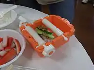 Ingredients in a manually operated sushi roll machine