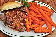 A side dish of crinkle cut fried sweet potatoes