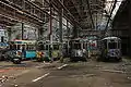 Heavily vandalized trams in the abandoned depot