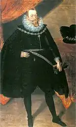 Bearded nobleman in black cape with high, white collar