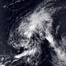 Satellite image of a weak tropical cyclone. The storm is characterized by disorganized cloud cover that encompasses most of the image. No land masses are visible in the image.