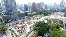 Cranes and construction machinery at an excavated construction site