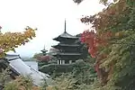 Two pagodas on a mountain slope.