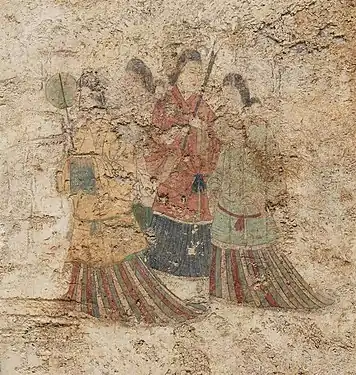 Women's dress under Goguryeo influence, with overlapping collar and mo skirt. Takamatsuzuka Tomb, c. 686 CE.