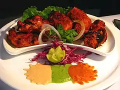 Image 27Chicken tikka, a well-known dish across the globe, reflects the South Asian cooking style.  (from Culture of Asia)