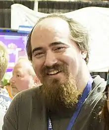 Tarn Adams is seen at a convention.