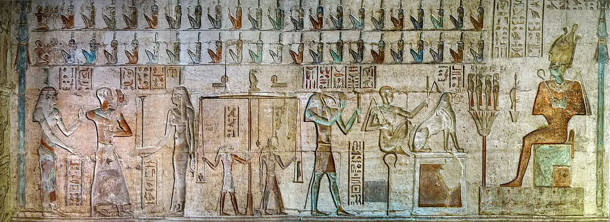 Full view of the Weighing of the Heart from the Temple of Hathor in Deir el-Medina. Thoth is seen to the right of the scale, while to the right, Ammit sits on top of a pedestal.