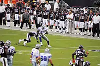 Tony Romo throwing to Roy Williams