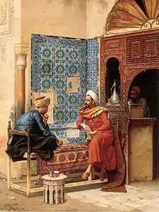 Image 29Chess game between Tha'ālibī and Bākhazarī, 1896 painting by Ludwig Deutsch (from History of chess)