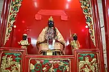 A shrine to Guan Di, flanked by Guan Ping and Zhou Cang.