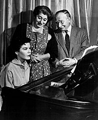 Uncle David and Molly with Rosalie at the piano