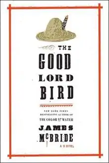 Inside an uneven red rectangular box is a straw hat (top), the book's name, and the author's name, in black font