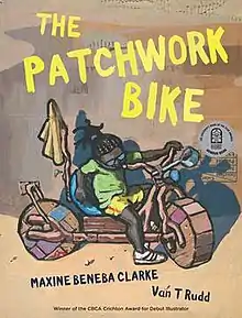 A boy sits atop his patchwork bike, with the book's title above it in yellow writing.