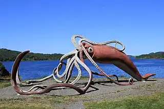 #45 (2/11/1878)A "life-sized" (55-foot) concrete and metal sculpture of the Thimble Tickle giant squid of 1878. Completed in 2001 and weighing 4 tonnes, it was designed by Don Foulds and built by him and his students, following a CA$100,000 government contribution (equivalent to US$64,568 in 2022).