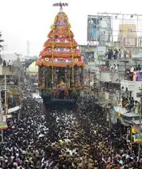 Decorated sooden car of a temple drawn by devotees