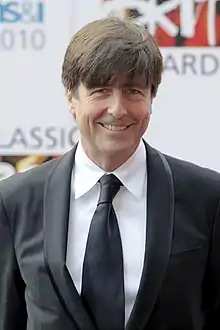 Thomas Newman wearing a suit attending the Classic Brit Awards.