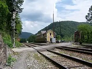 Thurmond Depot, now a New River Gorge National Park and Preserve visitor center, and a single track bridge which crosses the New River.