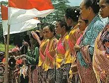 Image 99Timorese women with the Indonesian national flag (from History of Indonesia)