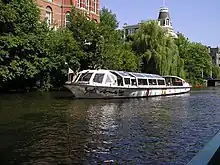 A tour boat passing nearby the Rijksmuseum in Amsterdam