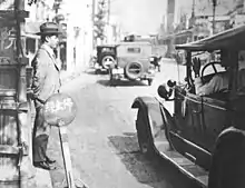 Image 1A Tokyo taxi driver indicating a fare of 50 Sen by holding up five fingers, in 1932 (from Transport in Greater Tokyo)