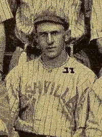 A black and white photograph of a man in a striped baseball cap and jersey with "Nashville" on the chest