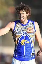 Male athlete in an Australian rules football game