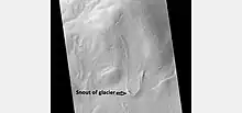 Tongue-shaped glacier, as seen by HiRISE under the HiWish program.  Ice may exist in the glacier, even today, beneath an insulating layer of dirt.