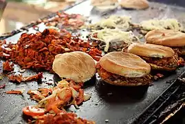 Tortas being prepared on a griddle in Oaxaca, Mexico