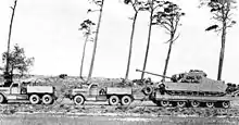 Two Diamond T tractors towing a Tortoise heavy tank, 1948