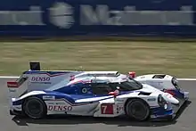 White-and-blue car on a track