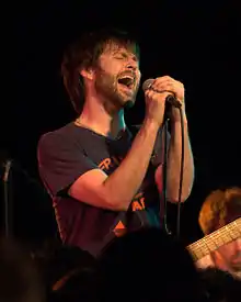 Morrison performing with The Dismemberment Plan at the Black Cat in Washington, D.C. on January 21, 2011