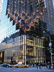 Exterior ground view of Trump tower, a contemporary skyscraper with a glass curtain and stepped façade