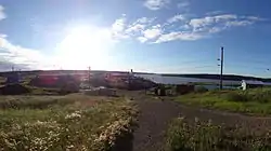 The Church in Tsiigehtchic with the Arctic Red River and Mackenzie River in the background