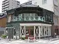 Tsukiji Storefront with copper wall and balcony cladding