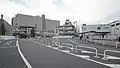 The temporary station forecourt and bus stops on the east side in November 2015