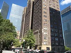 Looking north from 41st Street along the west side of Tudor City Place. Prospect Tower and Tudor Tower are across the street to the right. The glass buildings at One and Two United Nations Plaza are visible in the background, and the UN Secretariat Building, which also has a glass facade, can be seen at right.