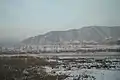 The Tumen River, at the border between North Korea and China. Picture taken from the Chinese side of the Tumen River at Tumen City; the city of Namyang, North Korea is on the other side of the river