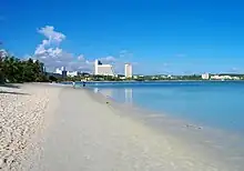 Beach, with modern buildings in the background