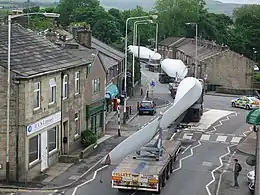 Image 1A turbine blade convoy passing through Edenfield in the U.K. (2008). Even longer 2-piece blades are now manufactured, and then assembled on-site to reduce difficulties in transportation. (from Wind power)